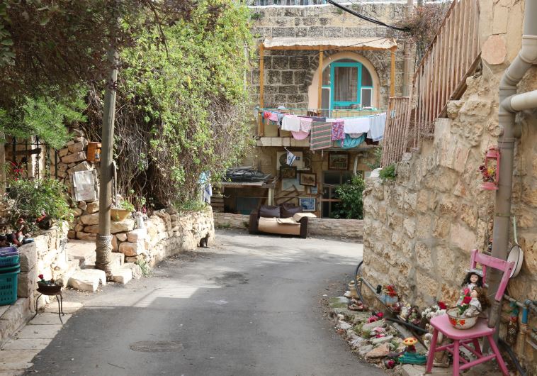 Dwellings of stone – and a doll – on Ha’ahayot Street.