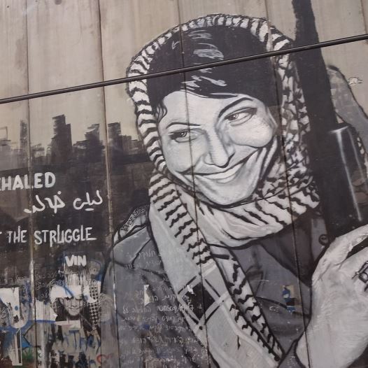 Graffiti depicting the PFPL plane hijacker Leila Khaled on the security barrier near Bethlehem