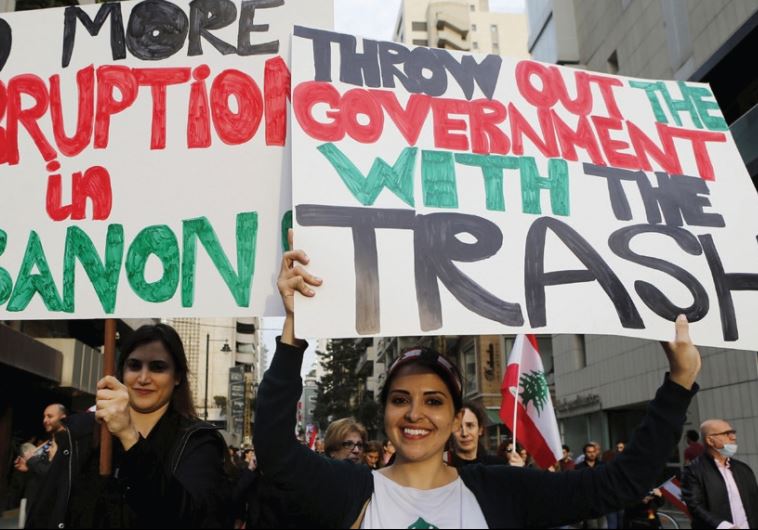 Demonstrators take part in a protest against the government’s failure to resolve a crisis over rubbish disposal in Beirut, March 12