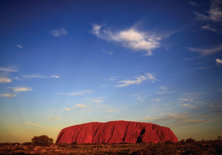 ULURU IS LIT by the setting sun in the Northern Territory in central Australia