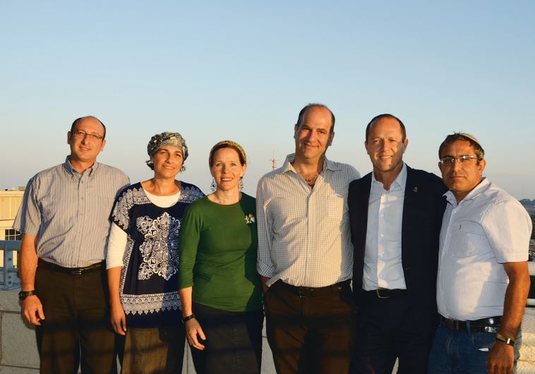 Mayor Nir Barkat (second from right) with the parents of the three murdered yeshiva students