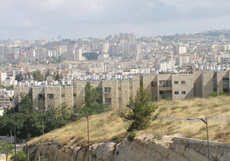 The Jewish neighborhood of Neveh Ya’acov with the settlement of Psagot in the background