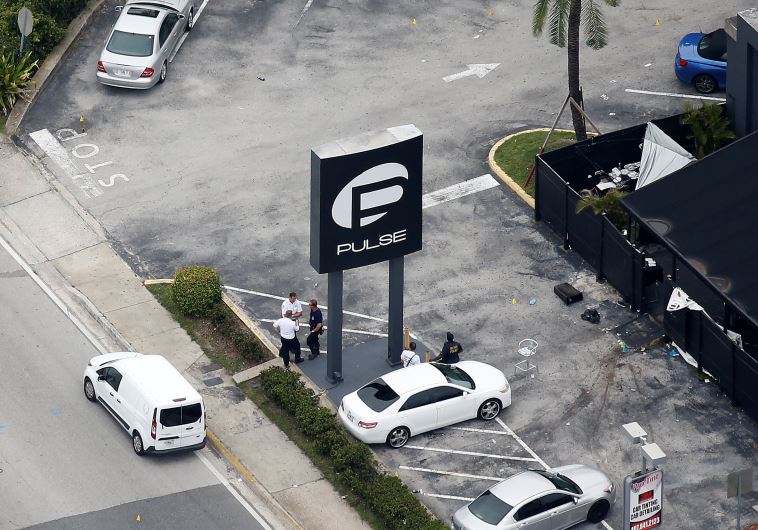 Investigators work the scene following a mass shooting at the Pulse gay nightclub in Orlando Florida, U.S. June 12, 2016.