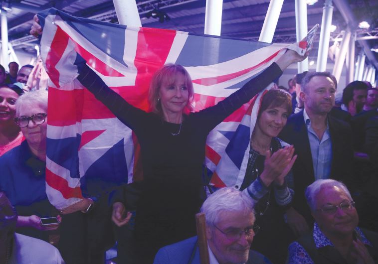 A ‘BREXIT’ SUPPORTER holds a Union Jack at a Vote Leave rally in London earlier this month.