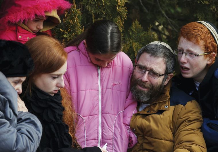 THE FAMILY of the late Dafna Meir mourn during her funeral ceremony in January.