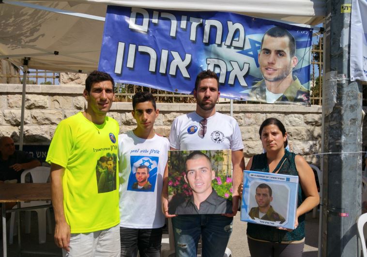 Family members of abducted soldier Oron Shaul demand his return in front of the Prime Minister’s Residence on Sunday