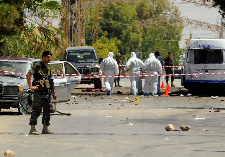 Lebanese army soldiers and forensic inspectors in Qaa