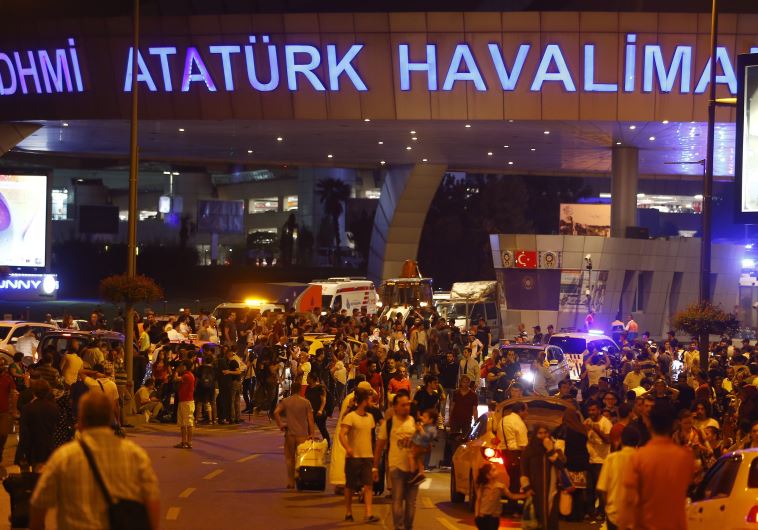 People leave Turkey's largest airport, Istanbul Ataturk, Turkey, following a blast June 28, 2016.