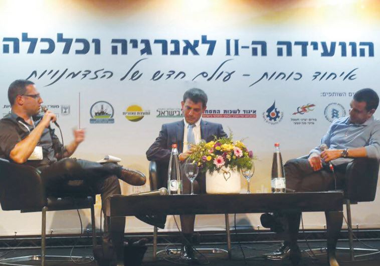 AMIT LANG, director-general of the Economy Ministry (right), Shaul Meridor, directorgeneral of the National Infrastructure, Energy and Water Resources Ministry (center), and moderator Avi Bar-Eli of ‘The Marker’ speak at the conference yesterday