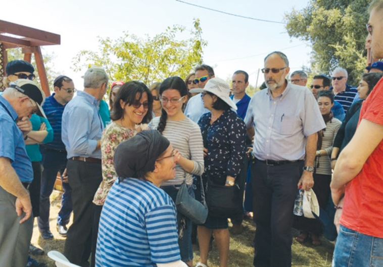 Mourners gather at the home of the Ariel family, whose daughter Hallel Yaffa (inset) was murdered by a Palestinian terrorist on June 30