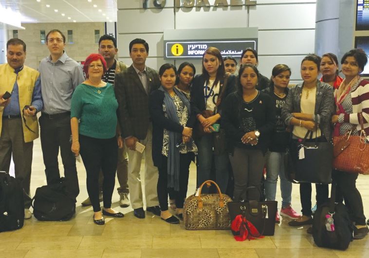 NEPALESE CAREGIVERS pose upon arrival at Ben-Gurion Airport recently.