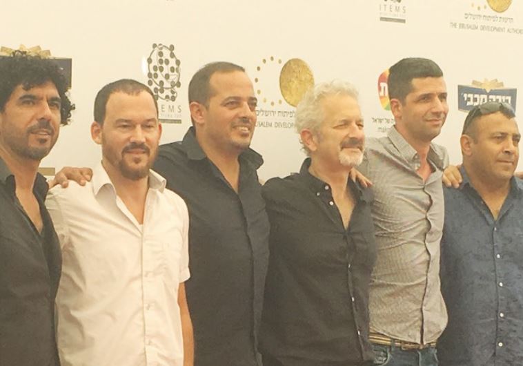 MUHAMMAD OWEDAH (third left), the Palestinian coordinator for Combatants for Peace, and film co-director Stephen Apkon (center) attend the premiere of ‘Disturbing the Peace’ last night.