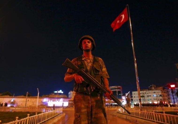 A Turkish military stands guard near the Taksim Square in Istanbul