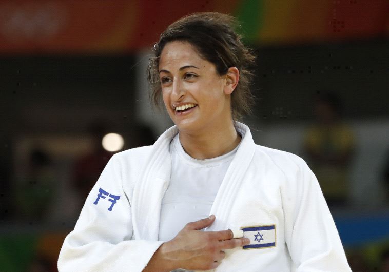 Yarden Gerbi celebrates after defeating Japan's Miku Tashiro during their women's -63kg judo contest bronze medal A match of the Rio 2016 Olympic Games in Rio de Janeiro on August 9, 2016