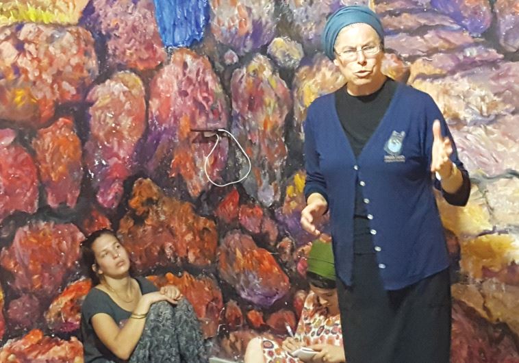 Tzipi Schissel, curator of the Hebron History museum, leads a tour of the site and discusses her personal connection to the massacre