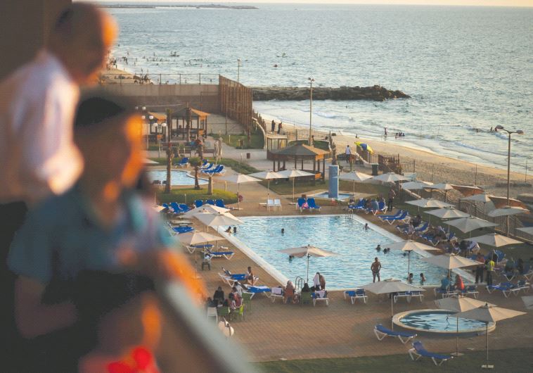 Palestinians are seen at the Blue Beach Resort in Gaza shortly after it opened in July 2015