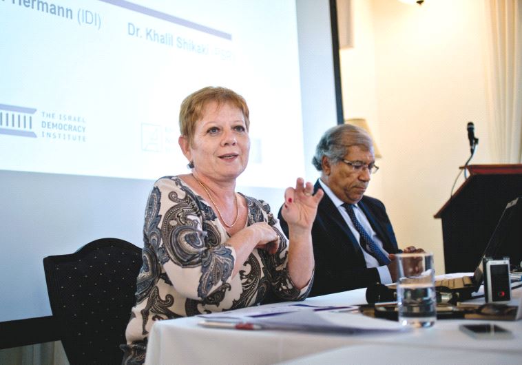 PROF. TAMAR HERMANN and Dr. Khalil Shikaki speak at this week’s press conference about a poll carried out by the Israel Democracy Institute and sponsored in part by the European Union.
