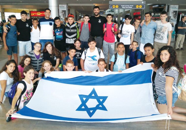 Druze children preparing to depart from Ben-Gurion International Airport