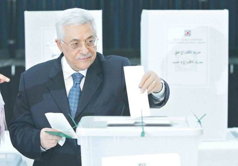 alestinian Authority President Mahmoud Abbas casts his vote at PA headquarters in Ramallah in 2005