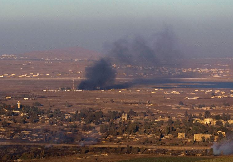 IS DETERRENCE working? Smoke rises last year on the Syrian side of the Golan Heights during fighting near the border.