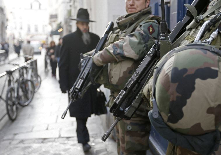 French soldiers patrol the street in a Jewish neighbourhood near a religious school and a synagogue as part of the highest level of "Vigipirate" security plan after the Islamist attacks in Paris January 20, 2015. 