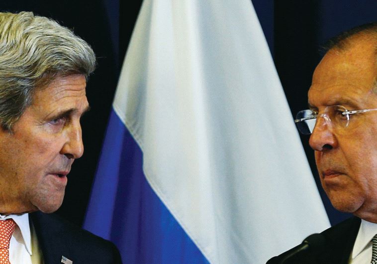 US Secretary of State John Kerry and Russian Foreign Minister Sergei Lavrov look toward one another during a press conference following their meeting in Geneva, Switzerland where they discussed the crisis in Syria, September 9