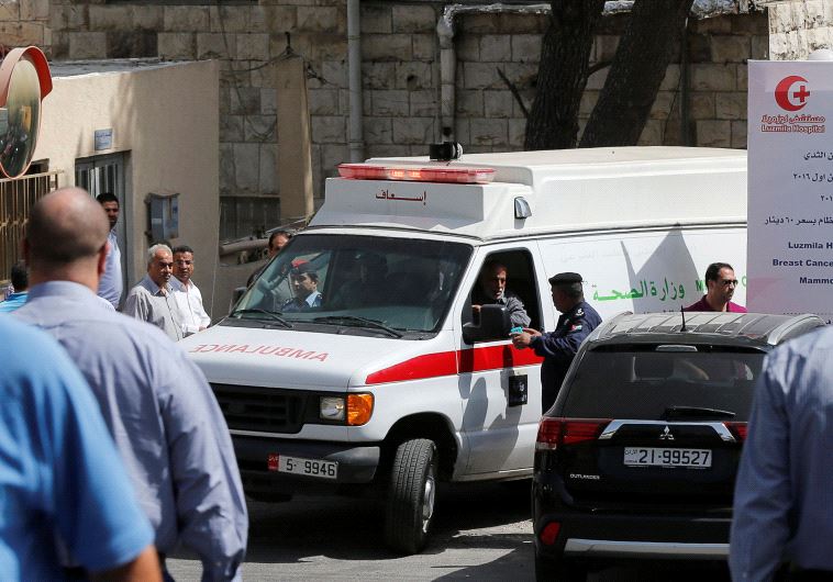 An ambulance transports the body of Jordanian writer Nahed Hattar to a medical facility after he was shot dead in Amman, Jordan, September 25, 2016