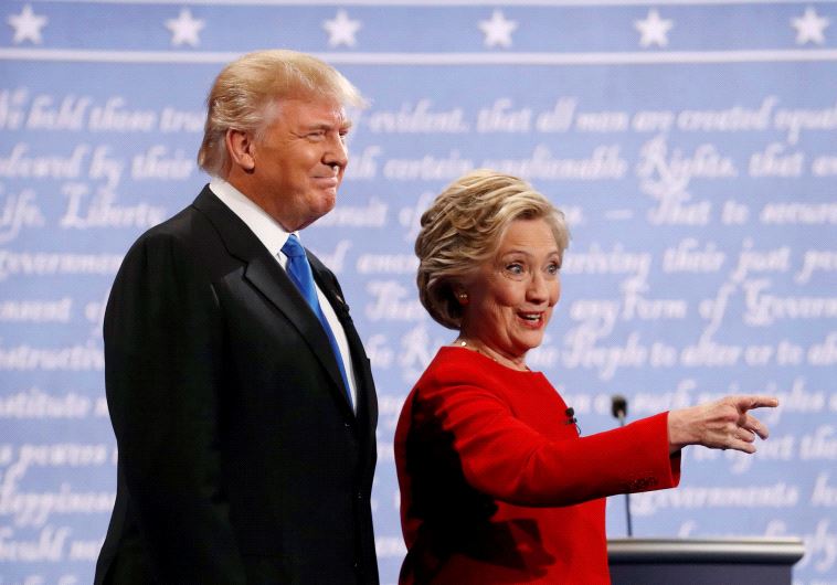 Donald Trump and Hillary Clinton look on at the start of their debate.