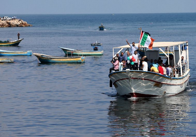 Palestinians ride a boat as they take part in a rally to show solidarity with Gaza-bound flotilla October 5, 2016.
