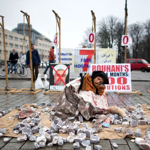 Exiled Iranians protest against executions and stonings in Iran during a demonstration on December 10, 2013 in Berlin
