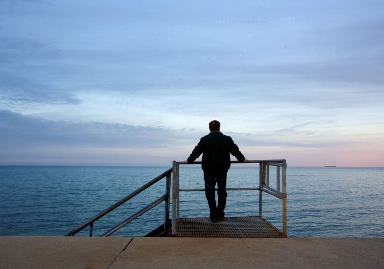 A man looking at the sea (illustrative)