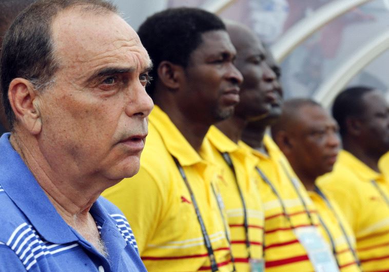 Ghana's head coach Avram Grant of Israel stands with his players.