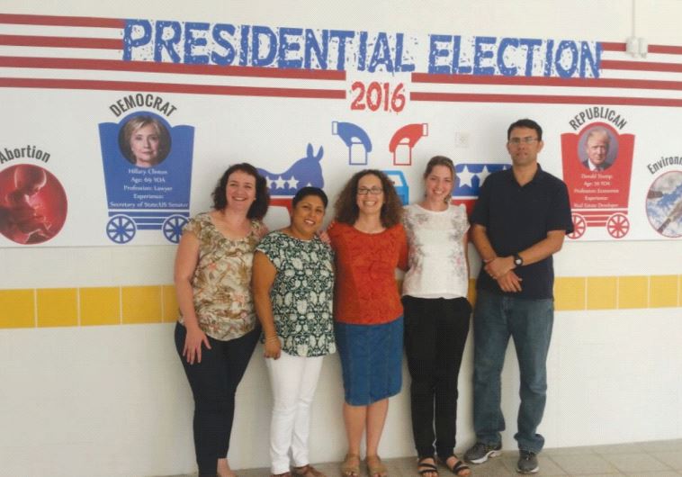 At the Ironi Heh High School, the English teachers who taught the election project flank some of the visuals
