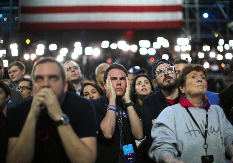 Supporters of Hillary Clinton watch and wait at her election night rally in New York. Supporters of Hillary Clinton watch and wait at her election night rally in New York. 