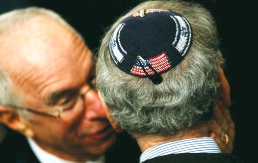 An American Jew wearing a kippa embroidered with the US and Israeli flags attends a Hanukka reception at the White House last year