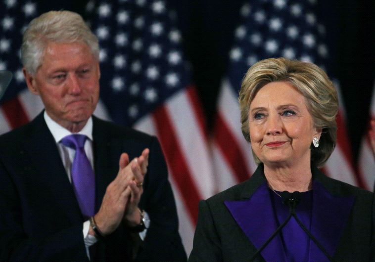 Hillary Clinton, accompanied by her husband former US President Bill Clinton (L), addresses her staff and supporters about the results of the US election.