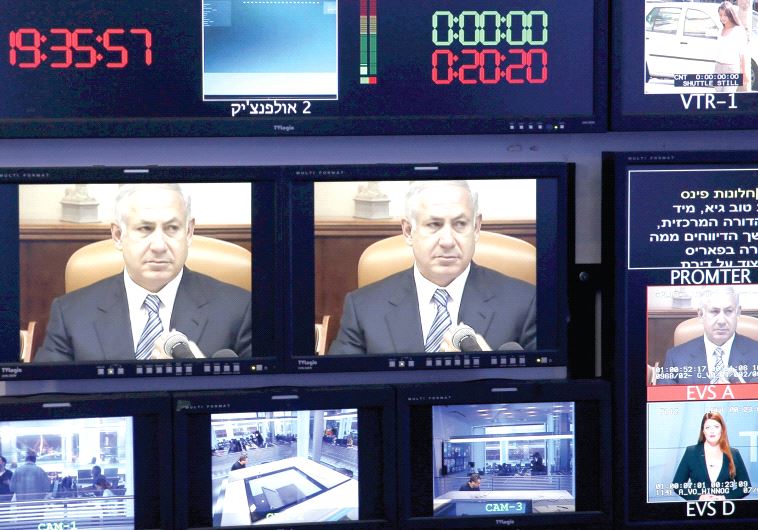 Prime Minister Benjamin Netanyahu, seen here on the monitors at Channel 10 News before an interview last year