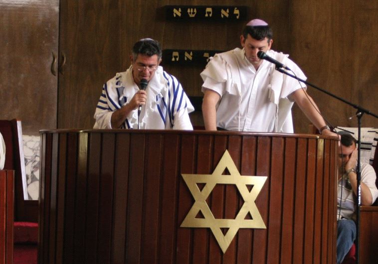Men pray in the Ashkenazi Templo Beth Shalom in Havana