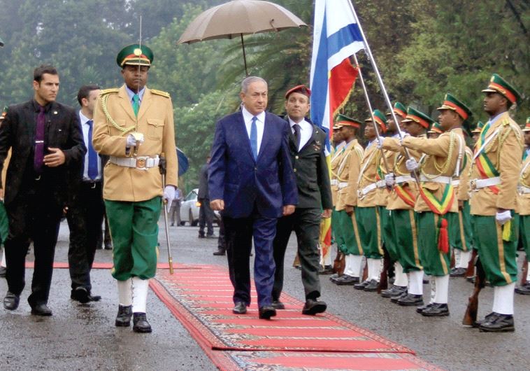 Netanyahu inspects a guard of honor at the National Palace during his State visit to Addis Ababa, Ethiopia, in July
