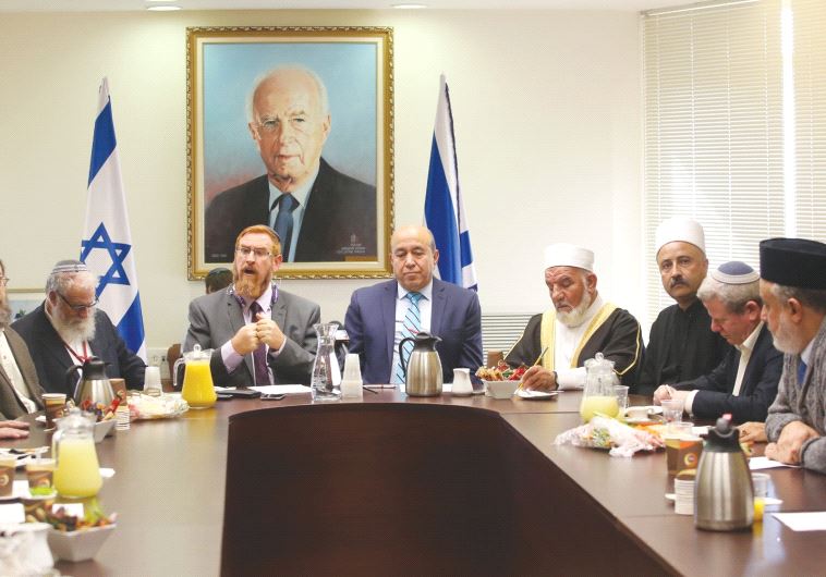 MKS YEHUDAH GLICK (rear left) and Zuheir Bahloul lead a conference at the Knesset yesterday, which was called in response to a proposal to ban religious institutions from using outdoor loudspeakers
