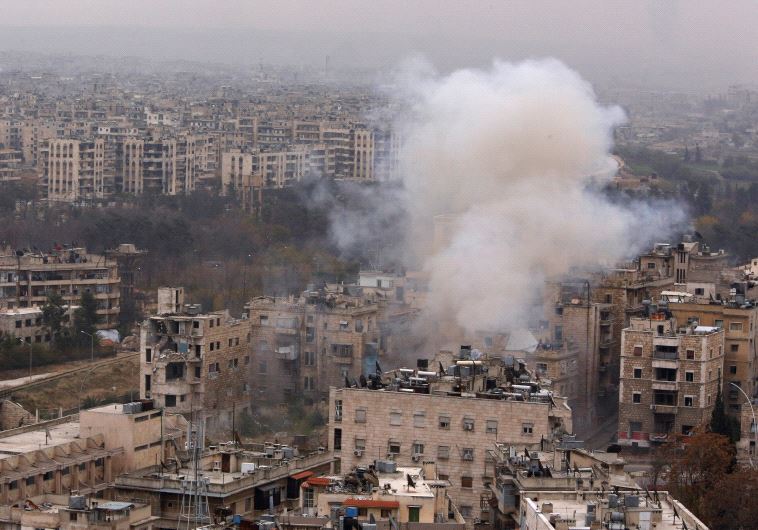 Smoke rises near Bustan al-Qasr crossing point in a government controlled area, during clashes with rebels in Aleppo, Syria December 5, 2016