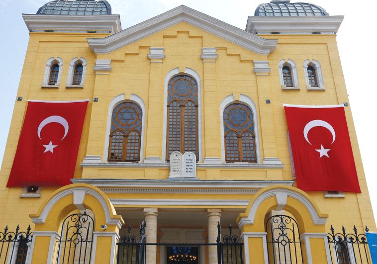 TURKISH FLAGS hang on the facade of the restored Great Synagogue before a re-opening ceremony in Edirne, in 2015.