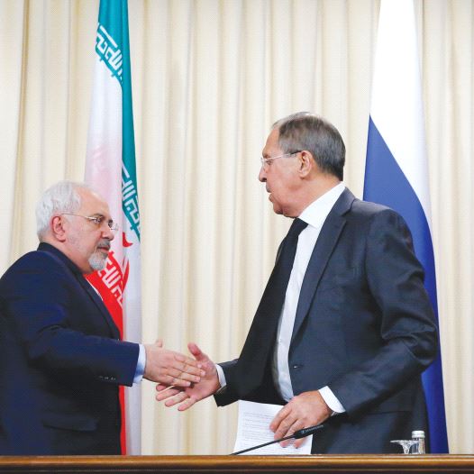 FOREIGN MINISTERS Sergei Lavrov of Russia (center) Mevlut Cavusoglu of Turkey (right) and Mohammad Zarif of Iran issued a declaration Tuesday on bringing an end to the Syrian civil war.