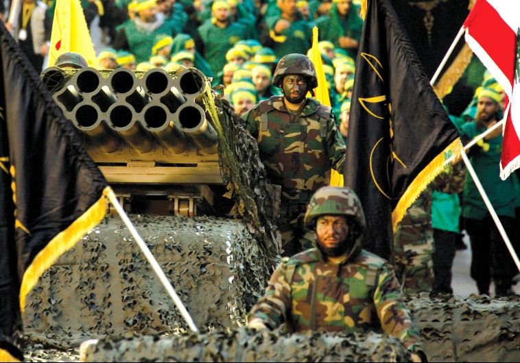 Hezbollah displays a pick-up truck mounted with a multiple rocket launcher in a parade in the southern Lebanese city of Nabatiyeh in 2014
