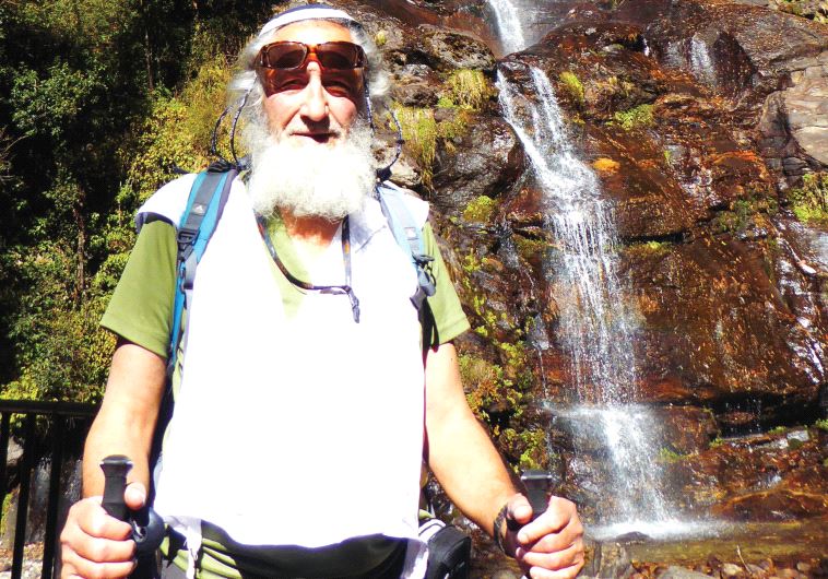 The writer pauses by a waterfall