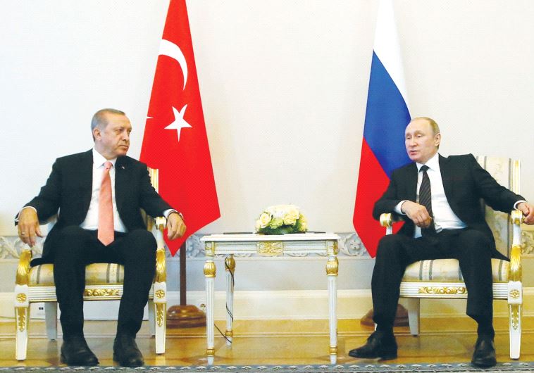 RUSSIAN PRESIDENT Vladimir Putin (right) speaks to Turkish President Recep Tayyip Erdogan during their meeting in St. Petersburg, Russia, in August.