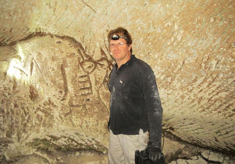 Hiker Mickey Barkal poses at the site
