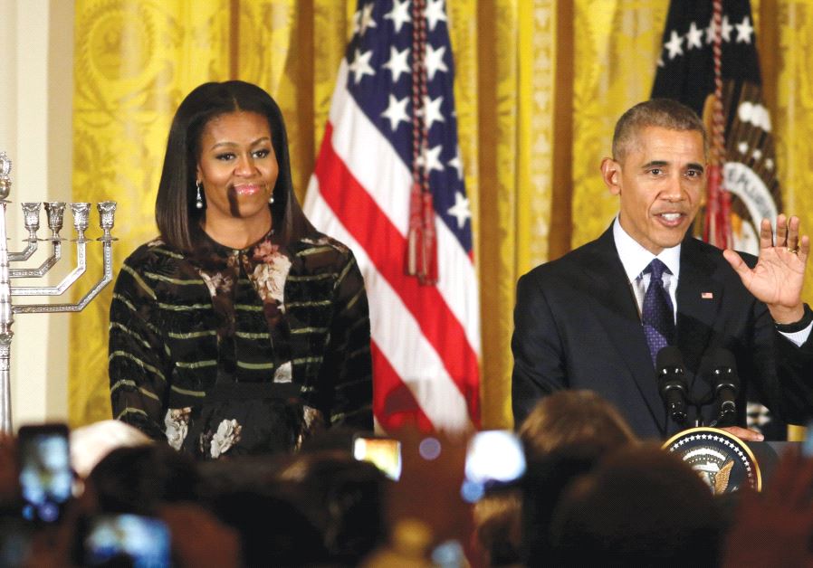 BARACK OBAMA speaks next to first lady Michelle Obama at a Hanukka reception at the White House in December 2016