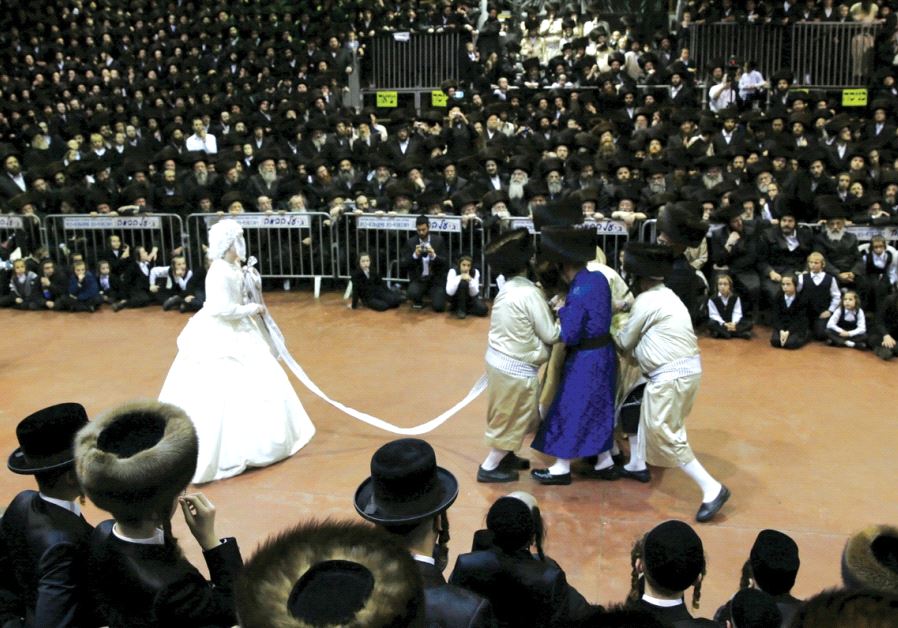 Thousands of ultra-Orthodox take part in a wedding linking two prominent Hasidic dynasties in Netanya, on March 16