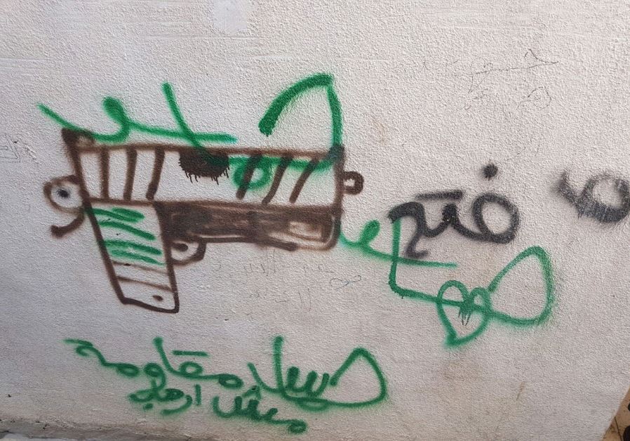 An image of the graffiti praising the terrorist in Sunday’s attack.